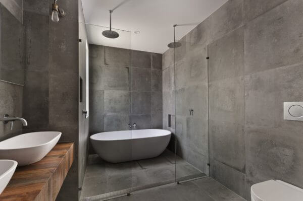 5 ideias para transformar seu banheiro com concreto: Do industrial ao minimalista; Como usar cimento queimado no box do banheiro: Guia completo; Cubas de concreto artesanais: O toque de luxo que seu lavabo precisa; Metais pretos e grafite: A combinação perfeita para banheiros de concreto; Elementos naturais no banheiro de concreto: Traga aconchego e sofisticação.