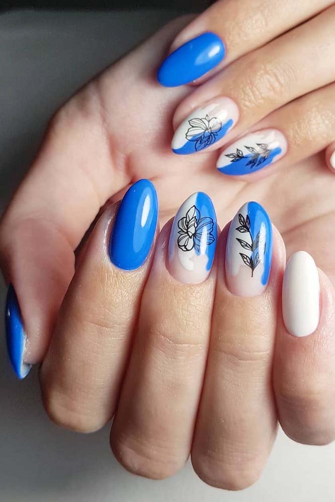 unhas azuis decoradas efeito olho de gato